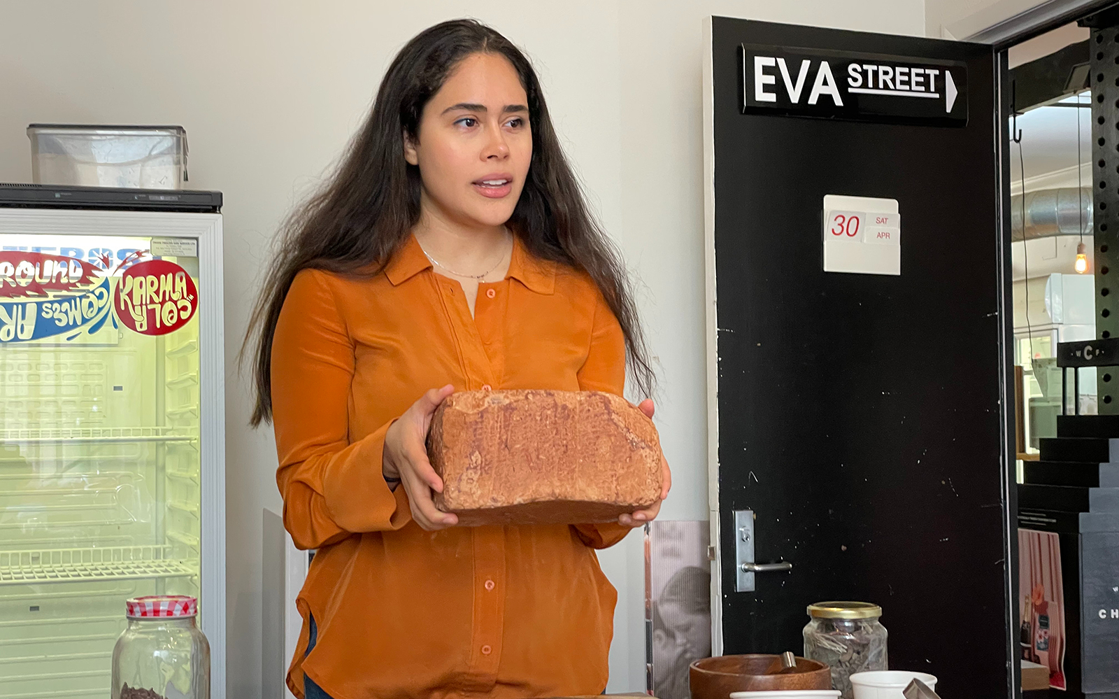 Person holding a large block of chocolate during a Wellington food tour.