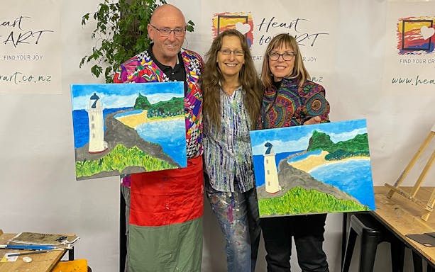 Participants display lighthouse paintings during a creative tour in Wellington.