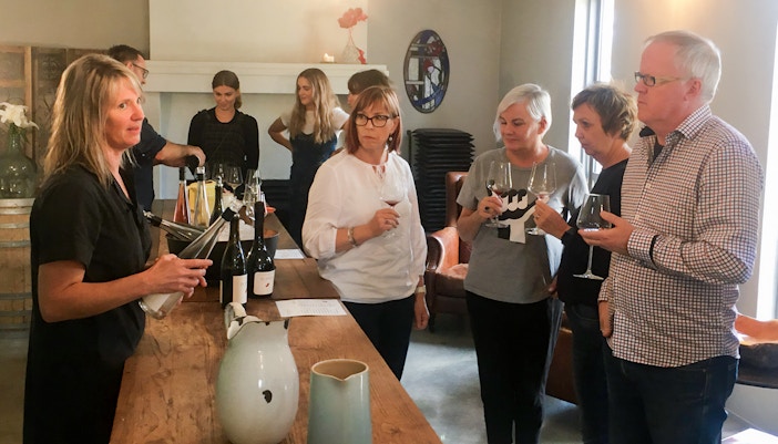 Wine tasting group at a Martinborough winery during the Foodie Delights Private Tour.