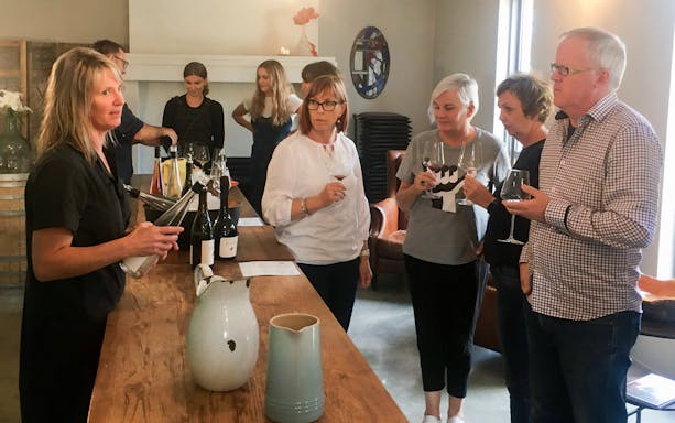 Wine tasting group at a Martinborough winery during the Foodie Delights Private Tour.
