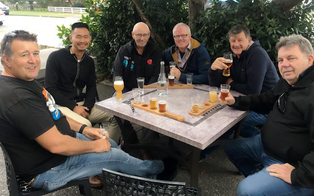 Group enjoying craft beer tasting on A Taste of Martinborough tour.