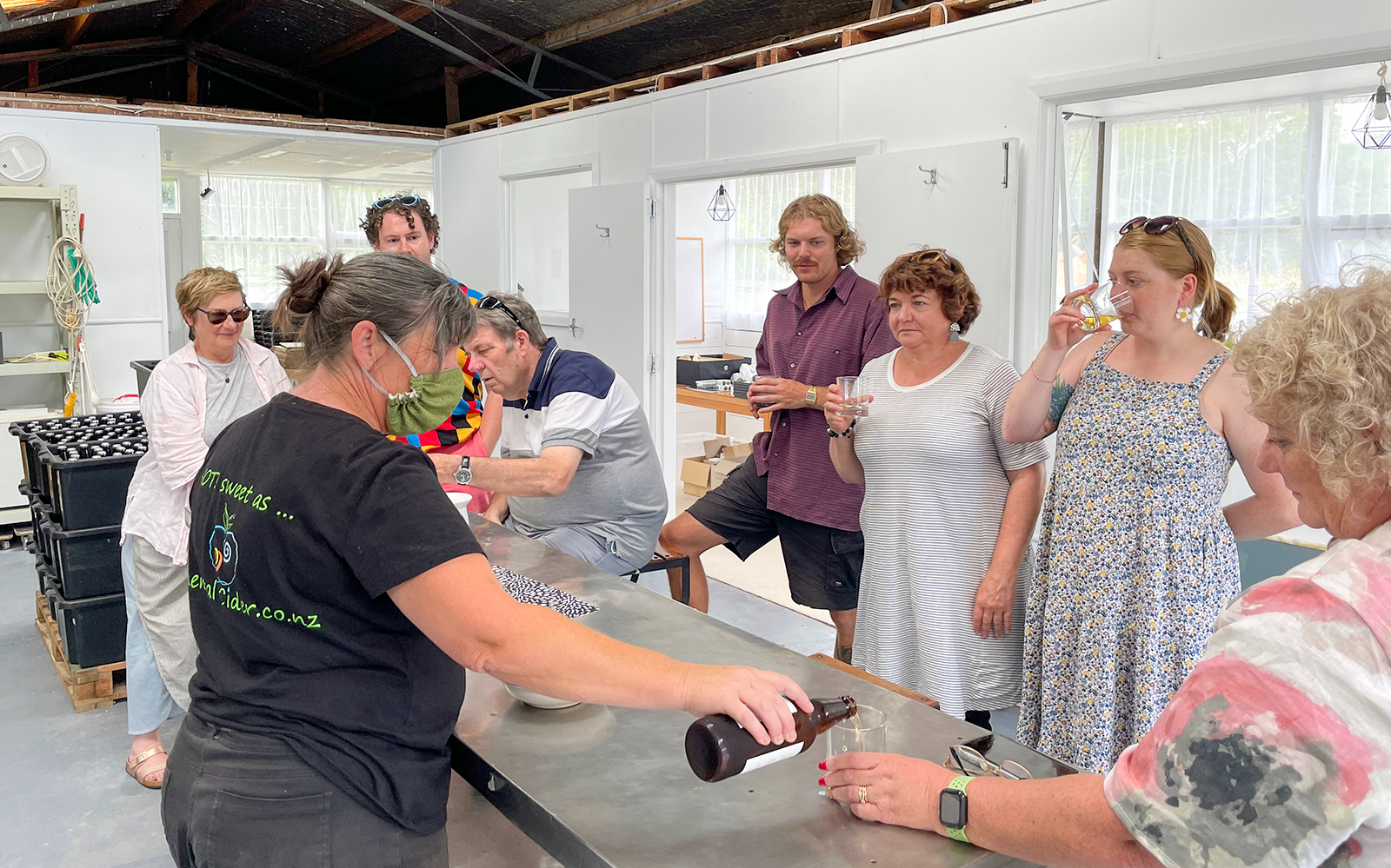 Group tasting cider during Kāpiti Coast food tour.