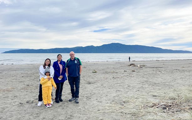 Family enjoying a beach view on the Kāpiti Coast during a private scenic tour.