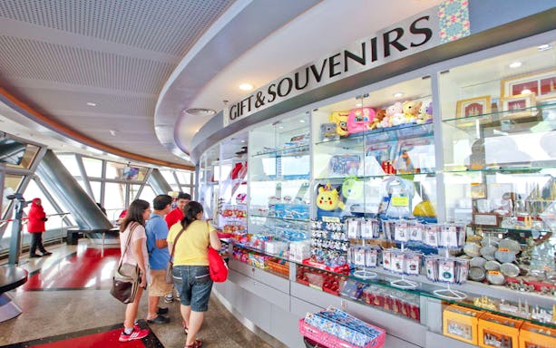 Gift shop at KL Tower Malaysia with visitors browsing souvenirs.