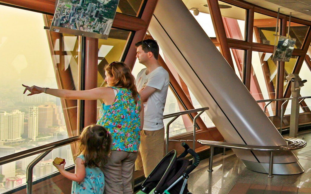 Visitors enjoying the view from KL Tower's Observation Deck in Malaysia.