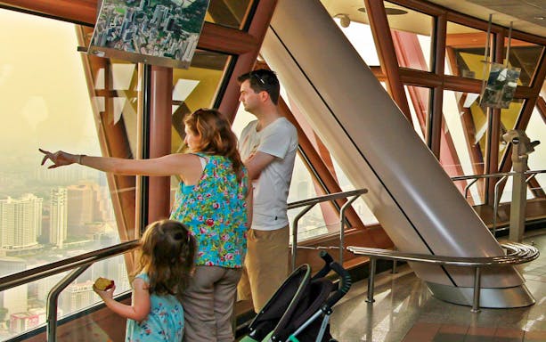 Visitors enjoying the view from KL Tower's Observation Deck in Malaysia.