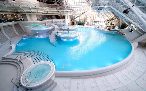 Indoor thermal pool at Caldea's Thermoludic spa in Andorra.