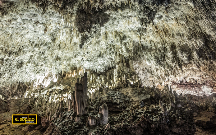Stalactites and stalagmites inside El Soplao Cave during a guided tour in Cantabria, Spain.