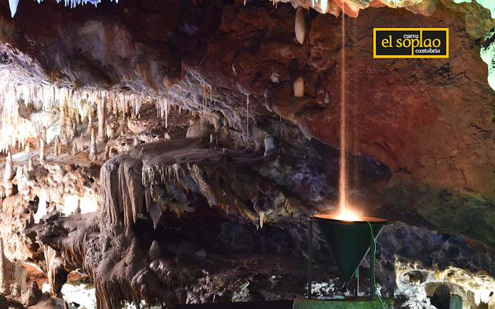 Stalactites and stalagmites inside El Soplao Cave during a guided tour in Cantabria, Spain.