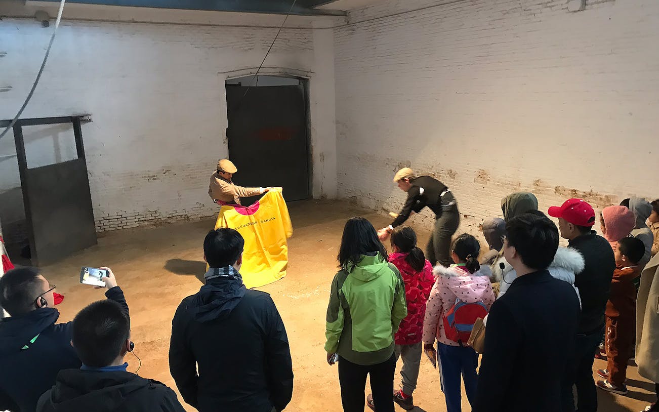Tour group watching a bullfighting demonstration at Las Ventas, Madrid.
