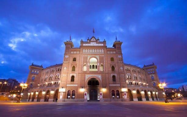 Las Ventas bullring facade in Madrid at dusk.