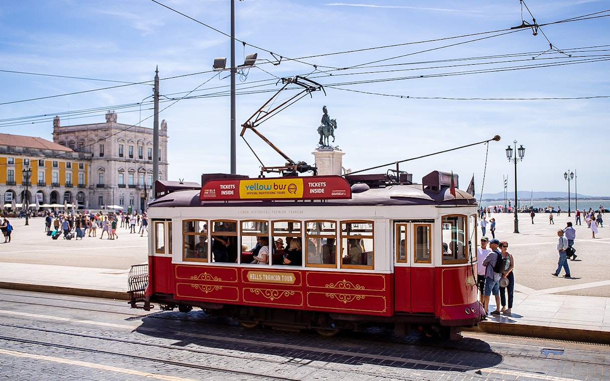 Lisbon tram in Praça do Comércio during a hop-on hop-off tour.