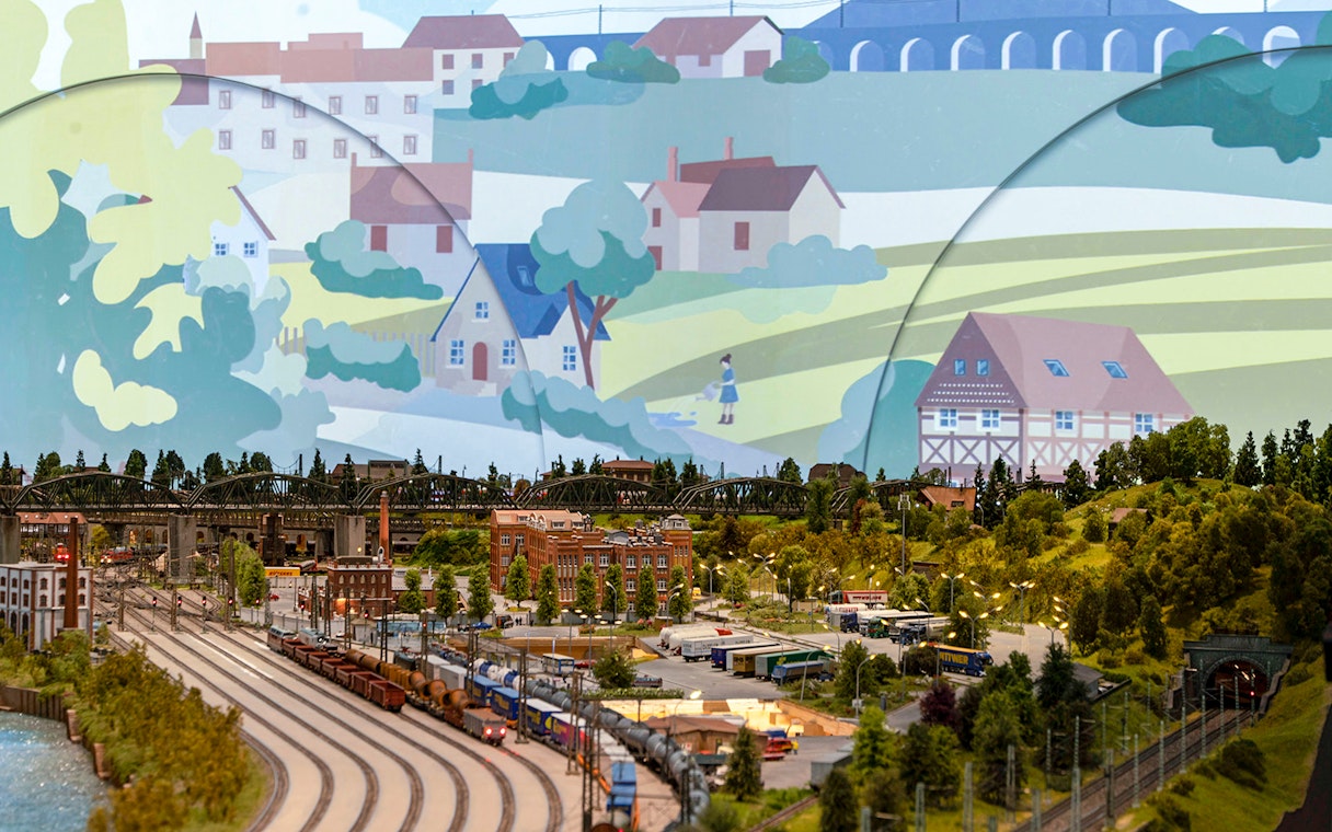 Miniature railway landscape with trains, buildings, and greenery at Hzero: The Miniature Railway Enterprise.