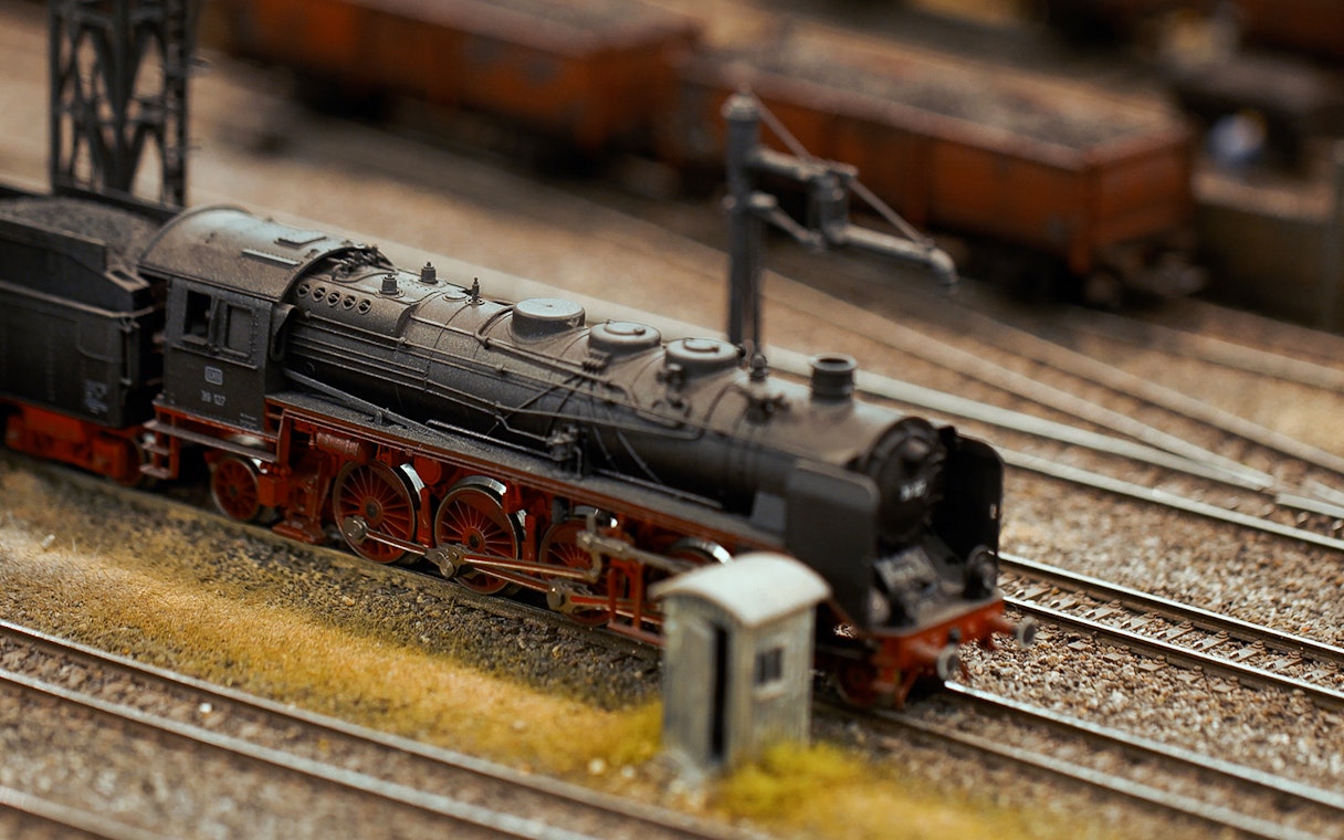Miniature steam locomotive on tracks at Hzero Miniature Railway Museum.