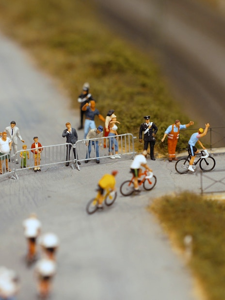 Cyclists and spectators at Hzero Miniature Railway Museum exhibit.