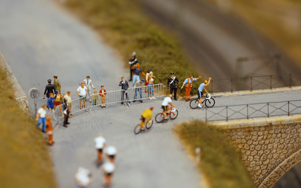 Cyclists and spectators at Hzero Miniature Railway Museum exhibit.