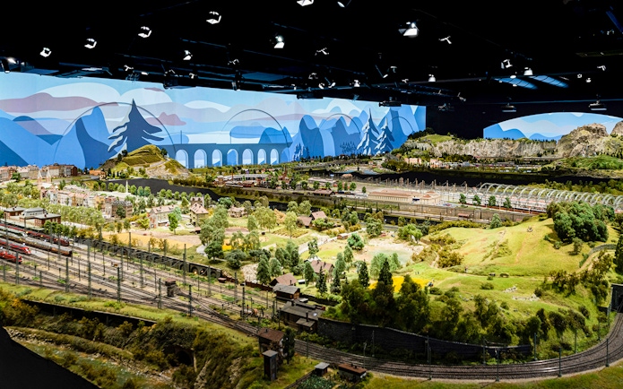 Miniature railway landscape at Hzero, featuring detailed model trains and scenic countryside.