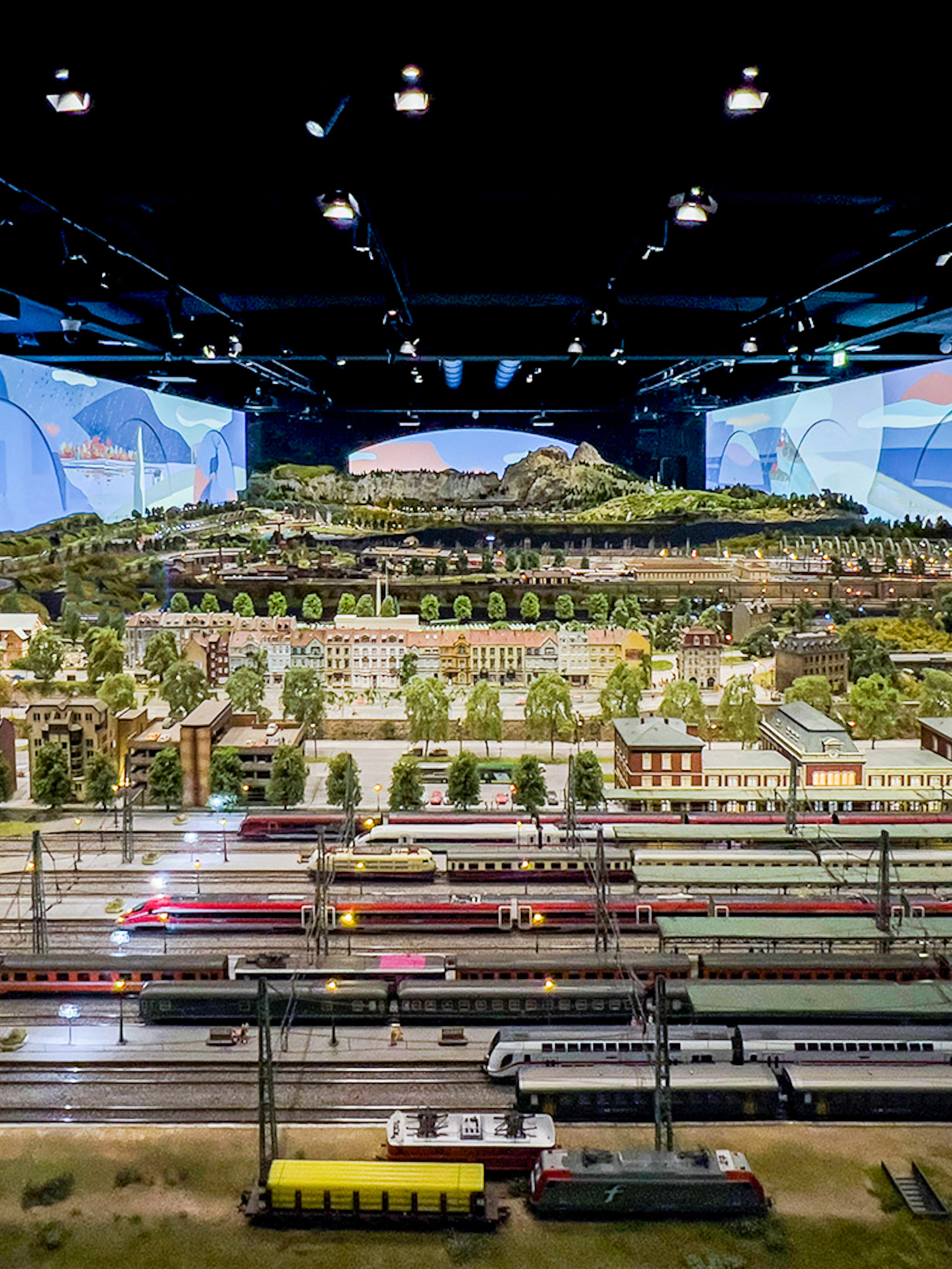 Miniature railway display at Hzero, featuring detailed landscapes and model trains.