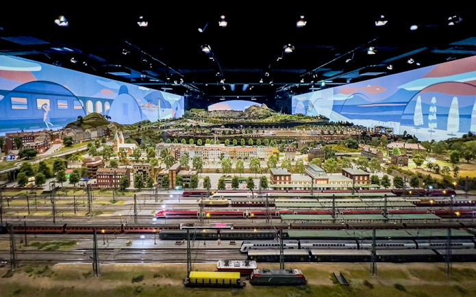 Miniature railway display at Hzero, featuring detailed landscapes and model trains.