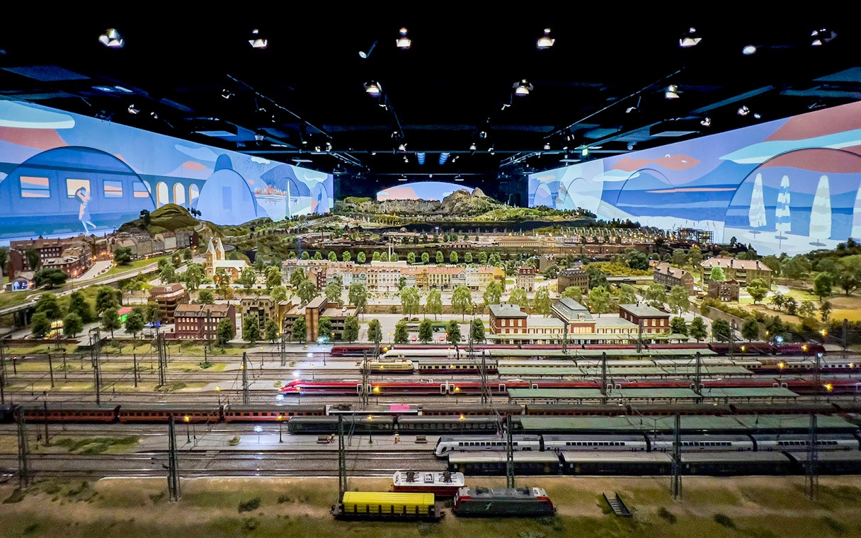 Miniature railway display at Hzero, featuring detailed landscapes and model trains.