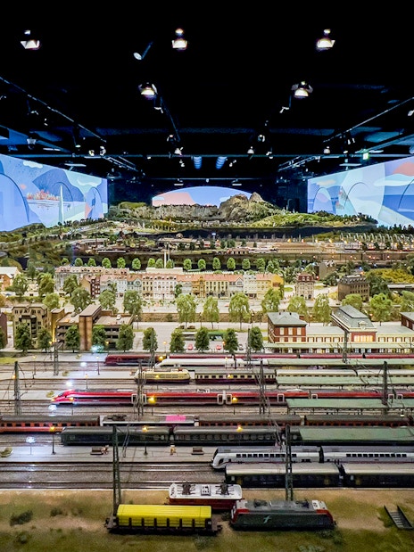 Miniature railway display at Hzero, featuring detailed landscapes and model trains.