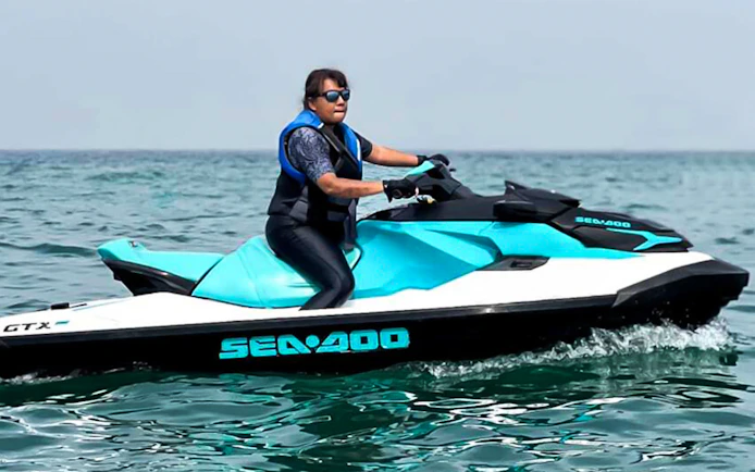 Person riding a jet ski on the ocean in Langkawi.