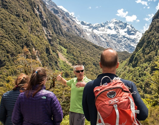 A tour guide showing around Milford track