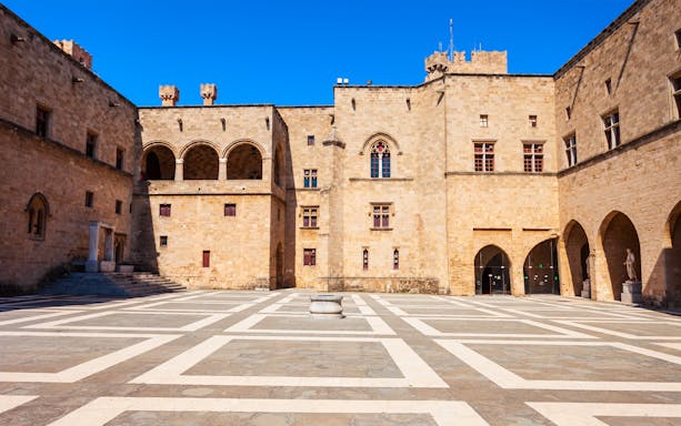 Palace of the Grand Master courtyard in Rhodes, Greece, with medieval architecture.