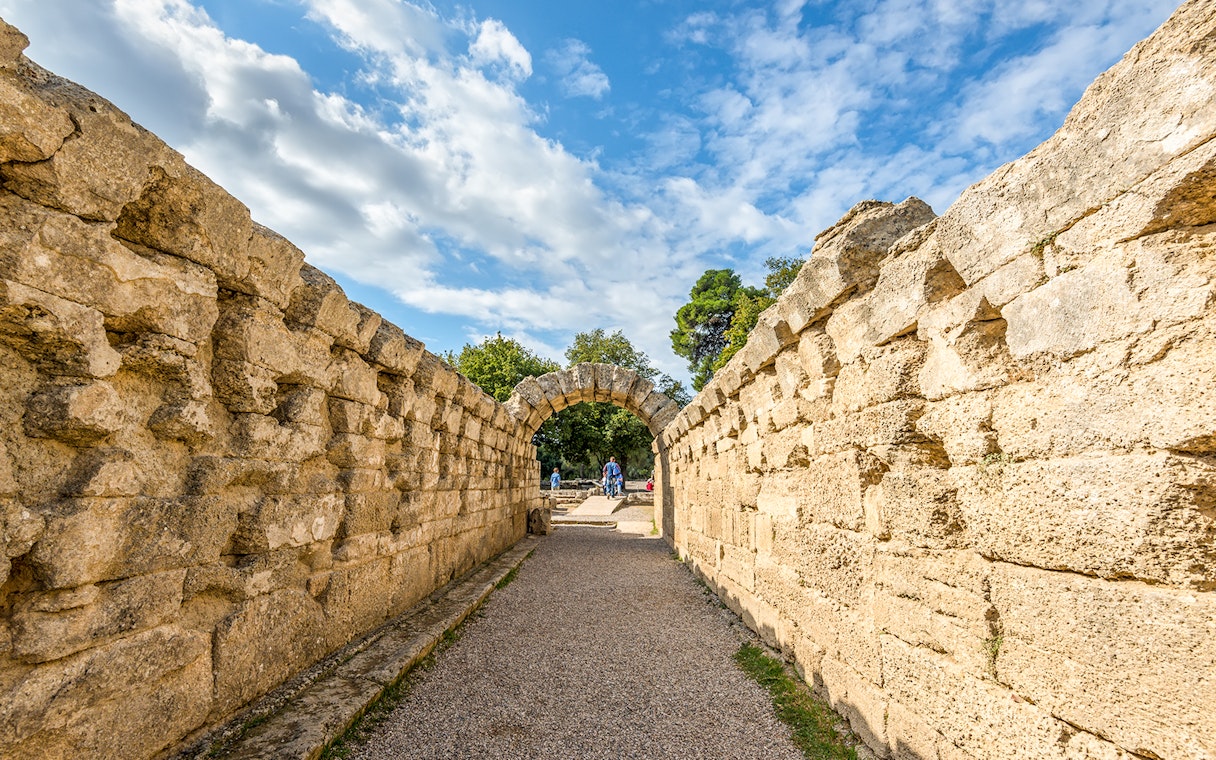 Ancient stone archway at Olympia Archaeological Site, Greece.