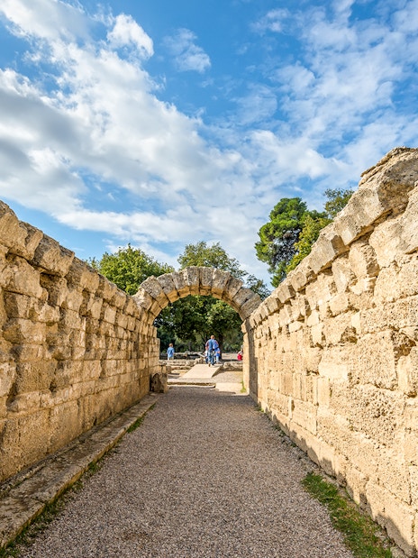 Ancient stone archway at Olympia Archaeological Site, Greece.