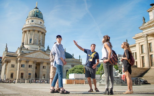 Tour group with guide at Gendarmenmarkt in Berlin.