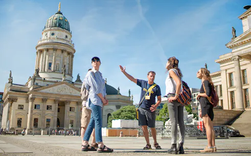 Tour group with guide at Gendarmenmarkt in Berlin.