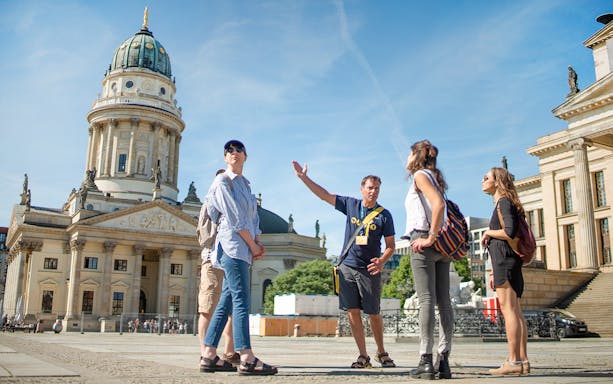 Tour group with guide at Gendarmenmarkt in Berlin.