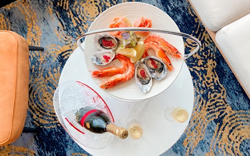 Seafood platter with prawns and oysters, Mumm Champagne bottle, Harbour Bar.