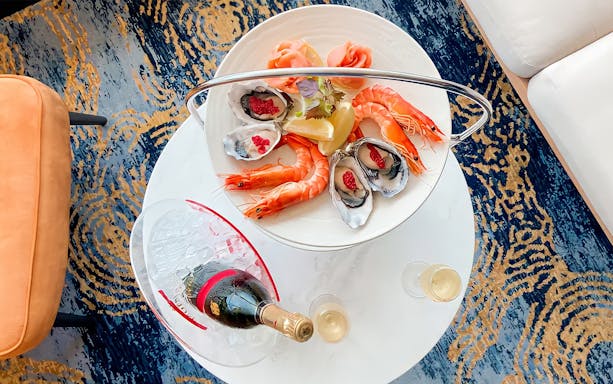 Seafood platter with prawns and oysters, Mumm Champagne bottle, Harbour Bar.