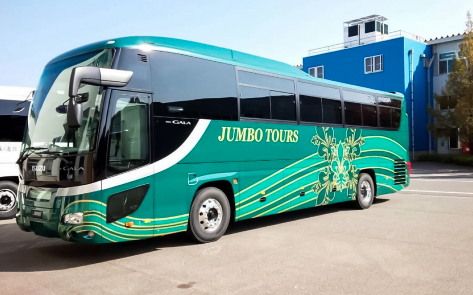 Tour bus for Okinawa Hip Hop Bus Tour parked outside.