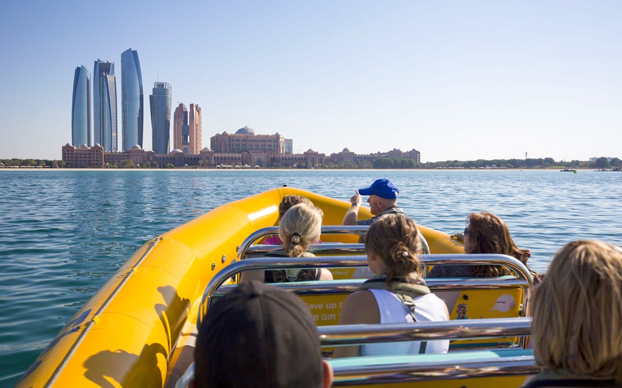Sightseeing speedboat tour in Abu Dhabi with skyline view.