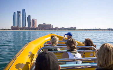 Sightseeing speedboat tour in Abu Dhabi with skyline view.