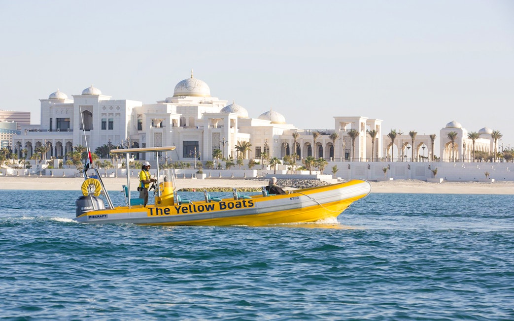 Yellow speedboat touring near Qasr Al Watan, Abu Dhabi.