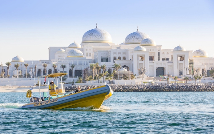 Yellow speedboat touring near Qasr Al Watan, Abu Dhabi.