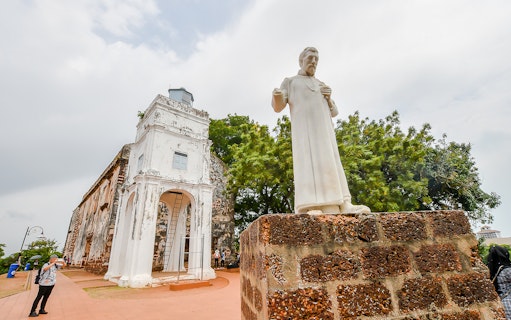 St. Paul's Church ruins and statue in Malacca, Malaysia, on a sightseeing tour from Kuala Lumpur.
