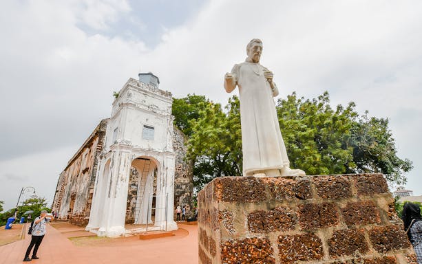 St. Paul's Church ruins and statue in Malacca, Malaysia, on a sightseeing tour from Kuala Lumpur.