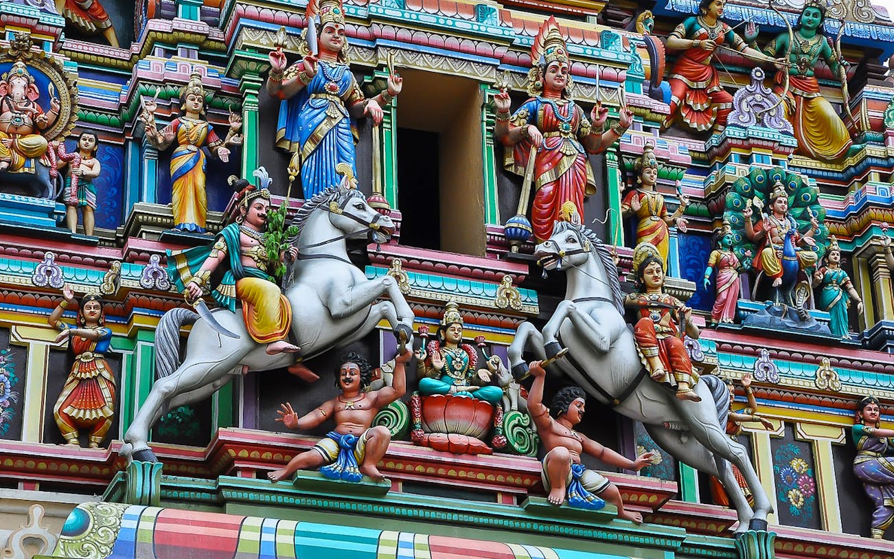Colorful Hindu temple facade with detailed sculptures in Kuala Lumpur.