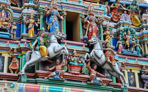 Colorful Hindu temple facade with detailed sculptures in Kuala Lumpur.