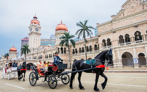 Horse-drawn carriage in front of Sultan Abdul Samad Building, Kuala Lumpur.