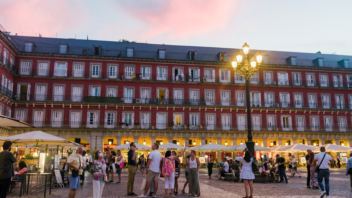 Plaza Mayor in Madrid bustling with people during a guided walking tour.