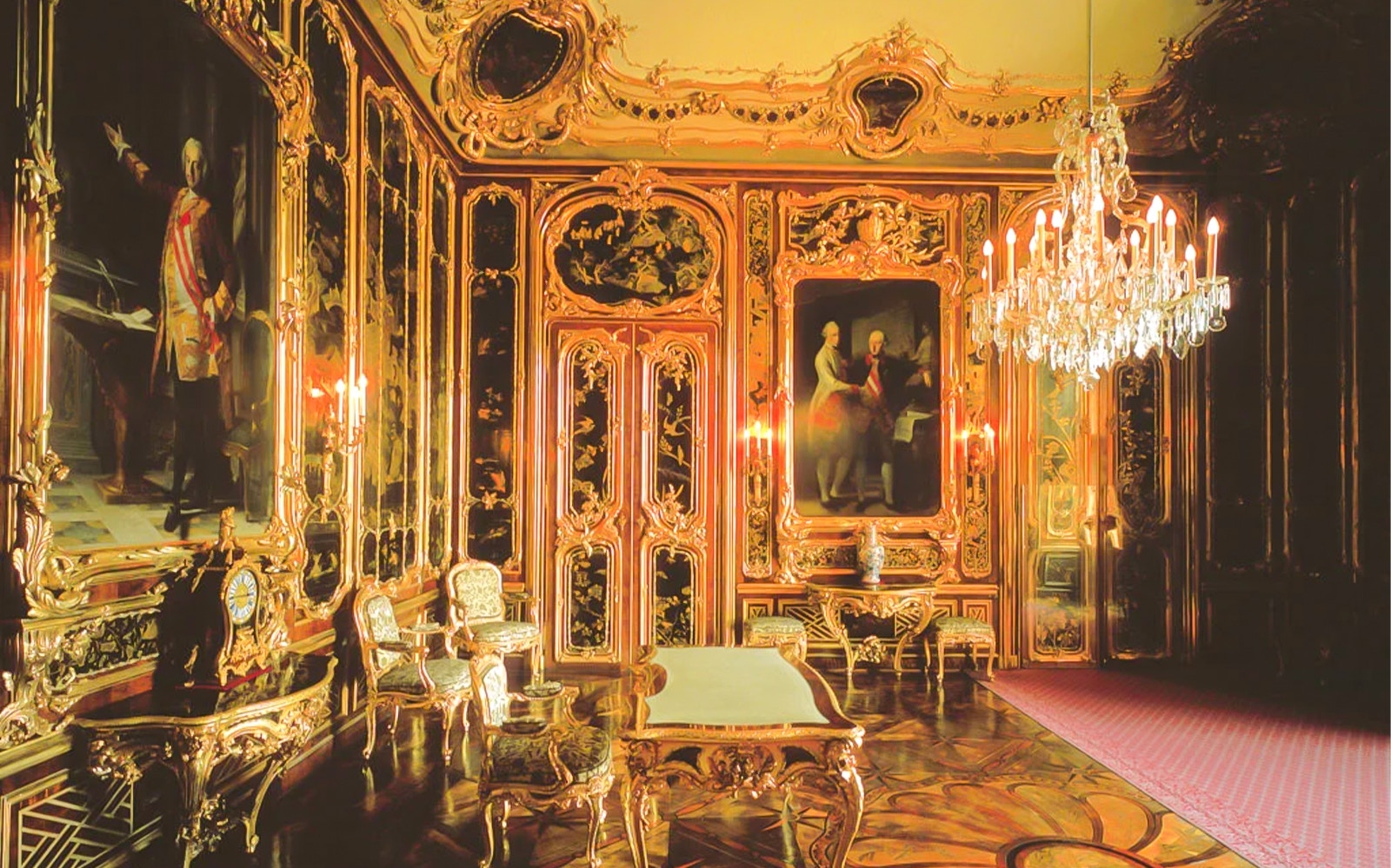 Schönbrunn Palace interior with ornate gold decor and chandeliers, Vienna.