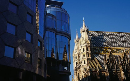 St. Stephen's Cathedral and modern building in Vienna, Austria.