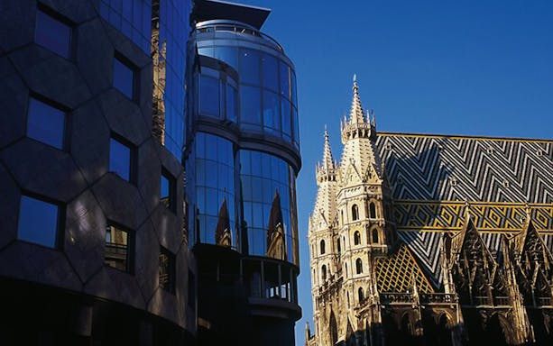 St. Stephen's Cathedral and modern building in Vienna, Austria.