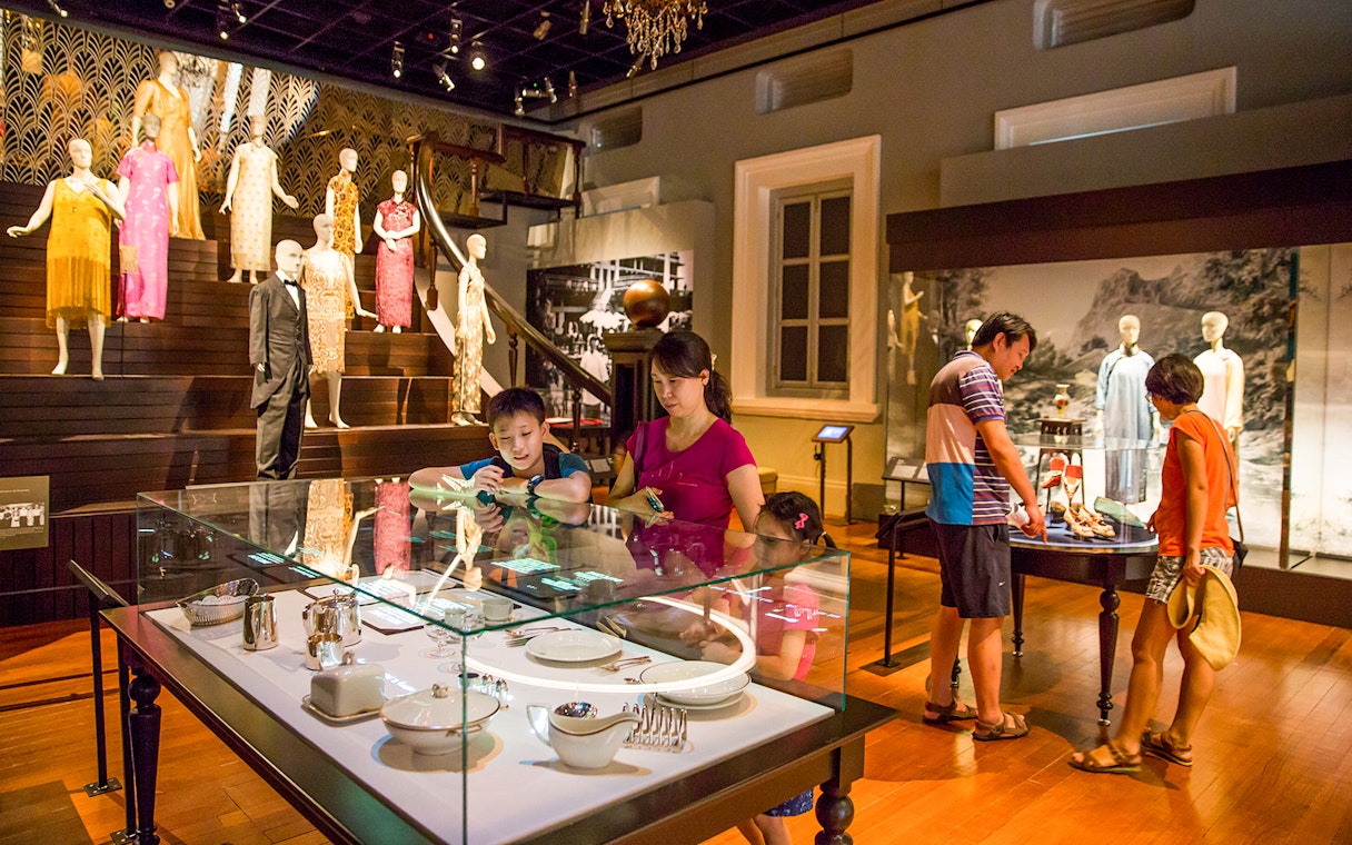 Visitors exploring exhibits at the Asian Civilisations Museum in Singapore.